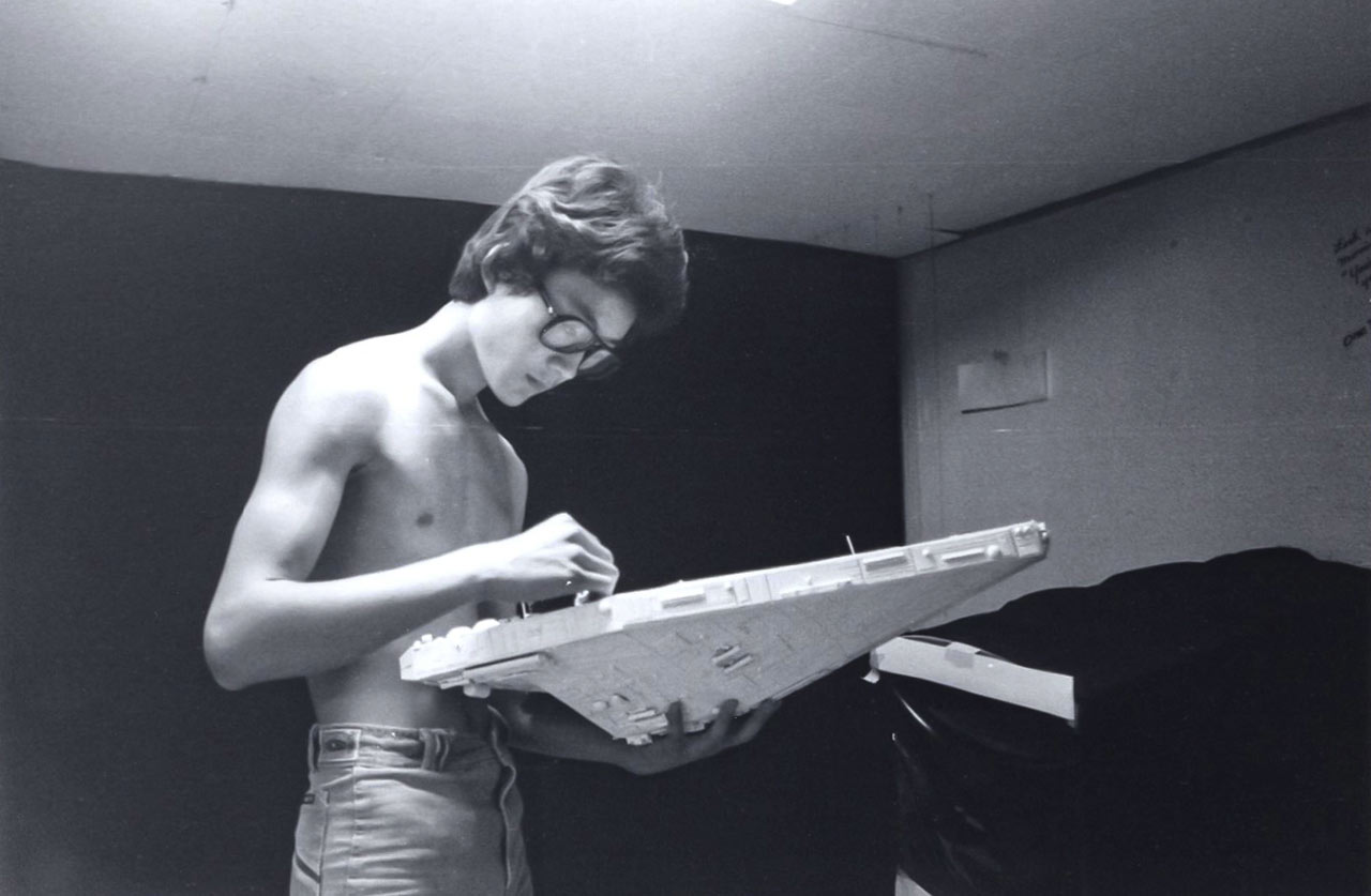Doug Chiang works on a spaceship made from poster board and model part kits for his film Side One.