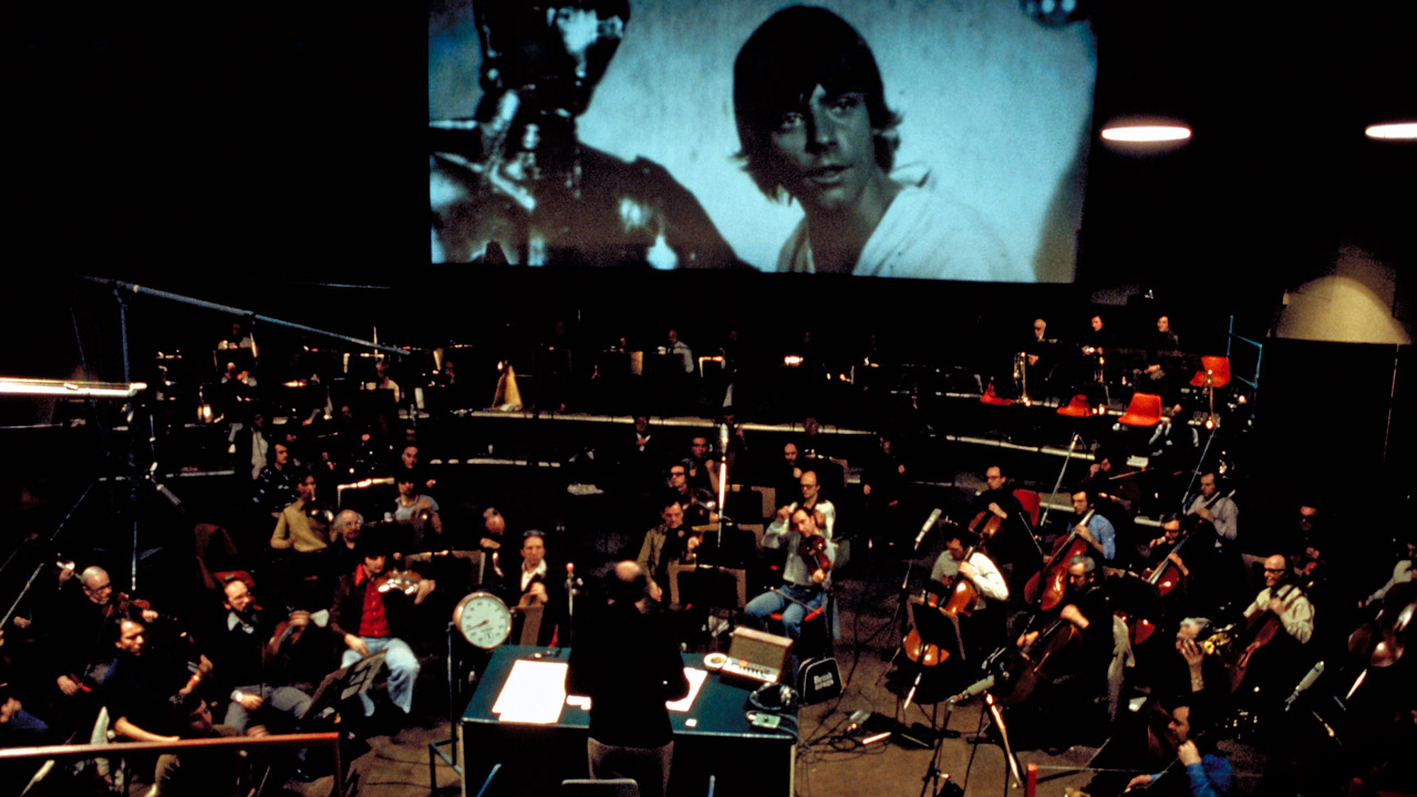John Williams conducts