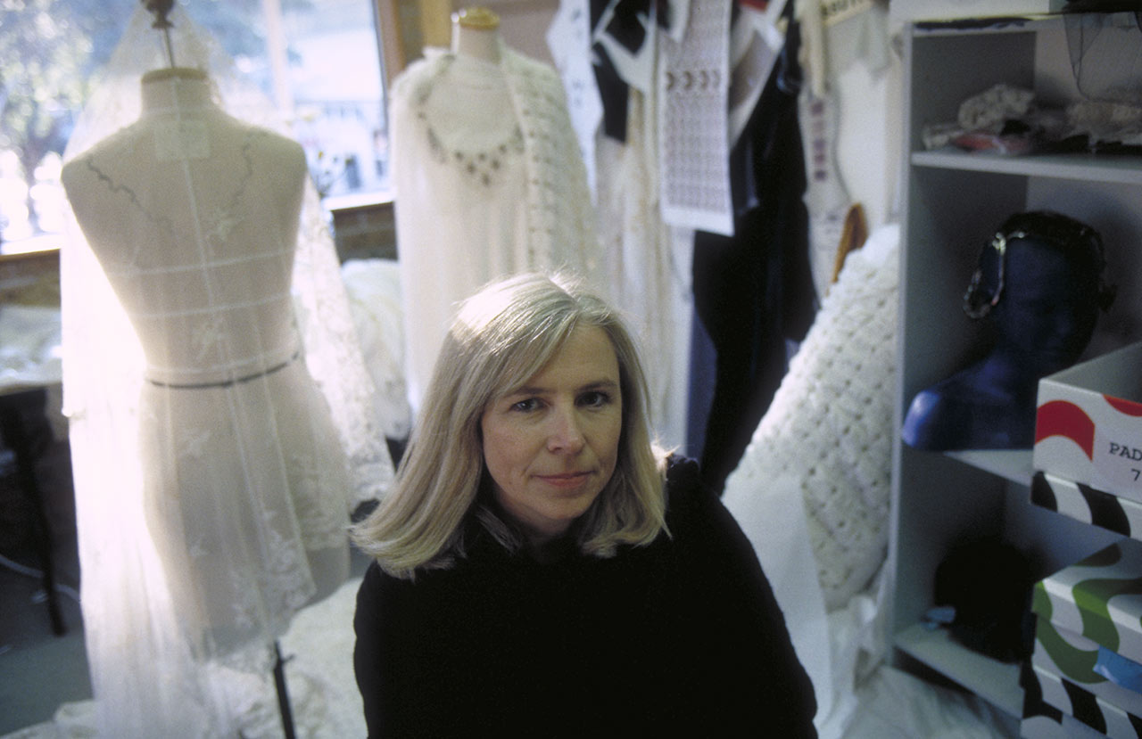 Trisha Biggar in front of a few of her designs for Attack of the Clones