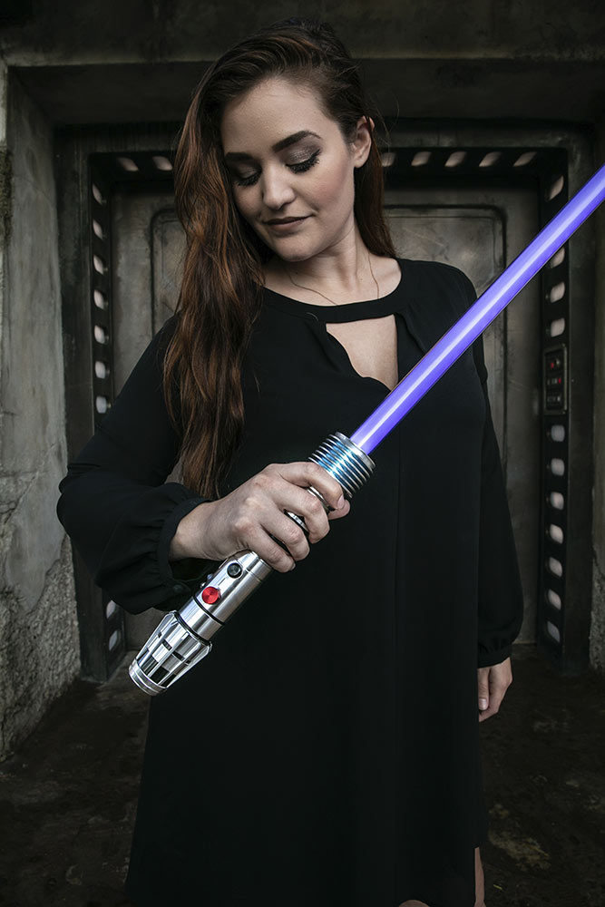 Lifestyle image of a lightsaber from DisneyParks